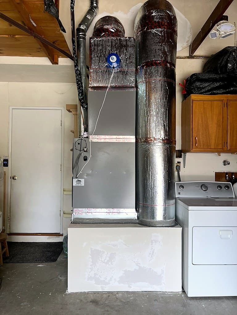 Furnace and flue in a garage after repair