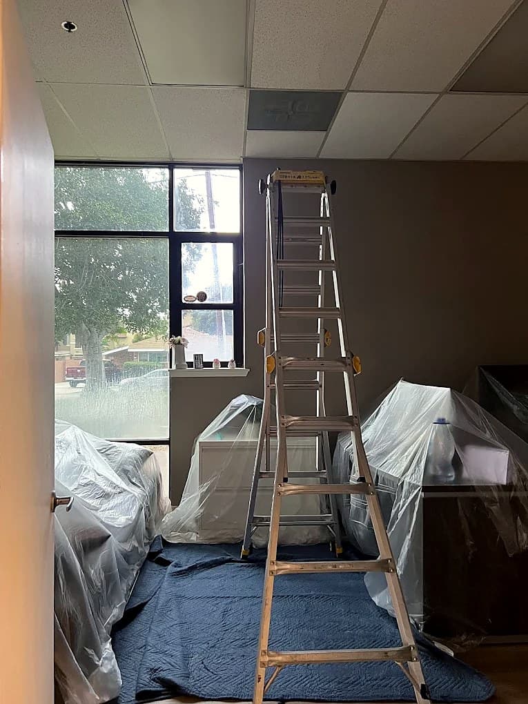 Work area protected with drop cloths and plastic before an install