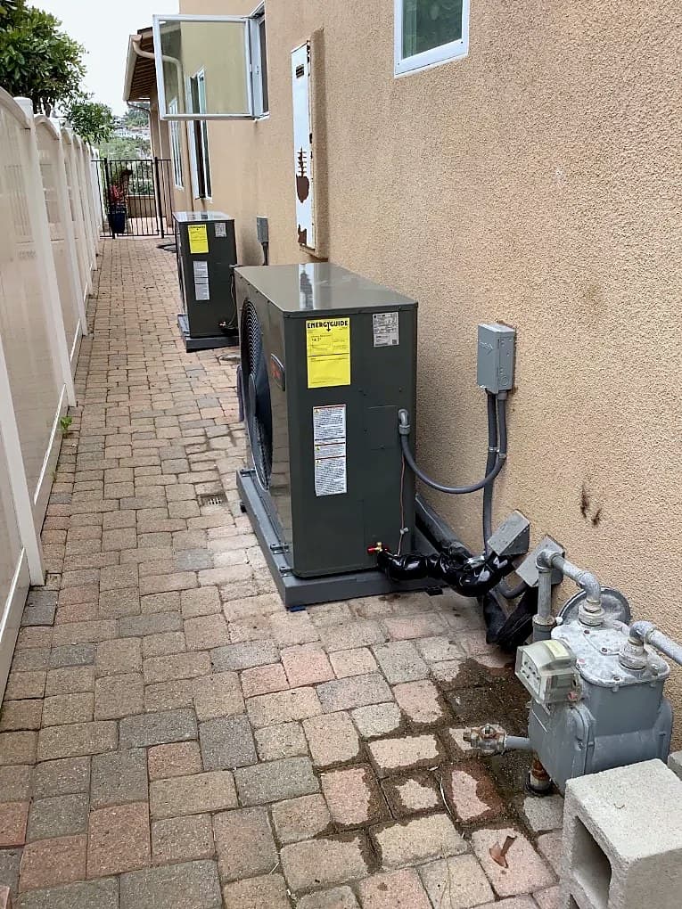 Outdoor condenser in a paved side yard